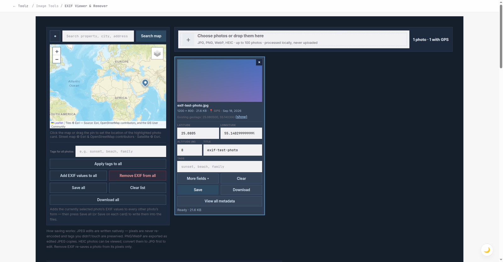 The EXIF Viewer, Editor and Remover with a test photo loaded: the map pin shows the photo's GPS location near Dubai, the card shows a GPS badge, and the latitude, longitude, altitude, title and tags fields are pre-filled ready to edit